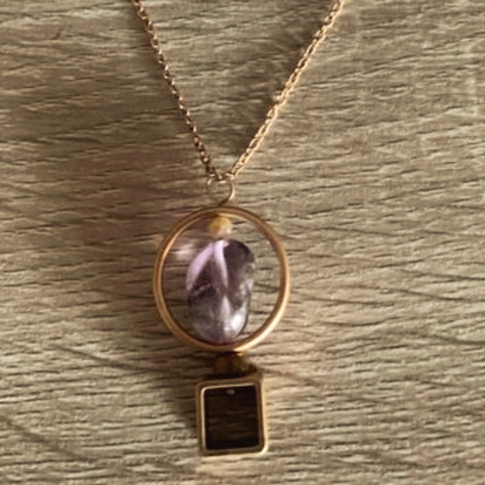 Long necklace. With purple details